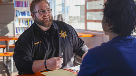 Probation Correctional Officer talking with youth