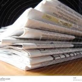 Stacked newspapers