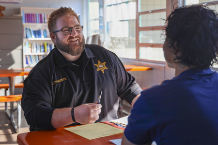 Probation Correctional Officer talking with youth